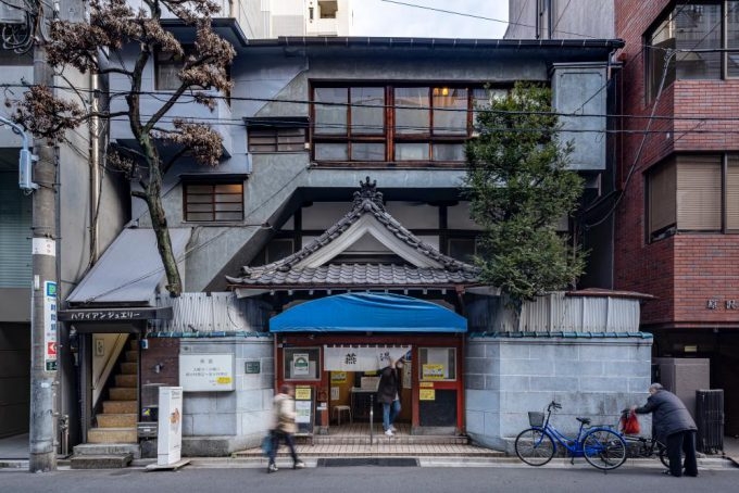 A view of a public bathhouse in downtown Japan.